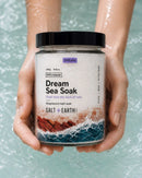 Salt + Earth Co Dream Sea Soak being held over water