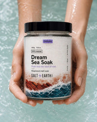 Salt + Earth Co Dream Sea Soak being held over water